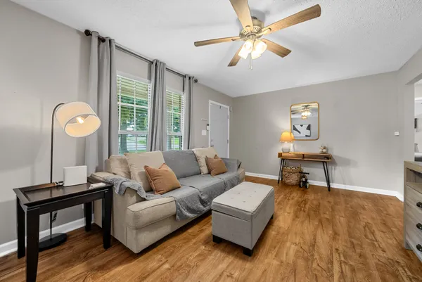 a living room with furniture and a window