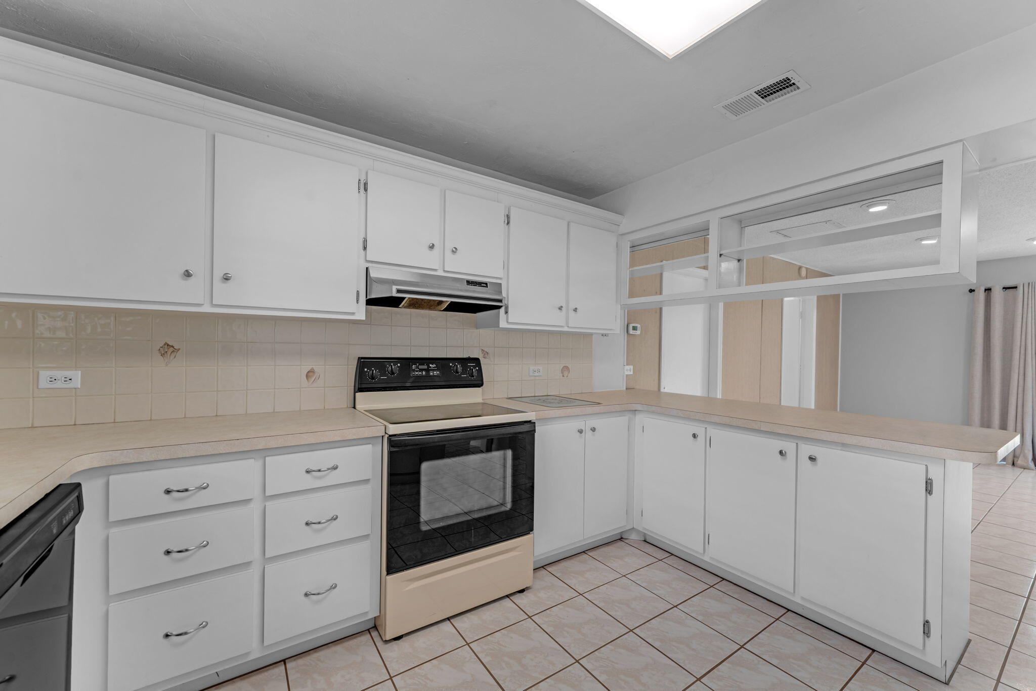 920 La Paloma Road Key Largo, FL 33037 - Photo 18 of 44 a kitchen with white cabinets and sink