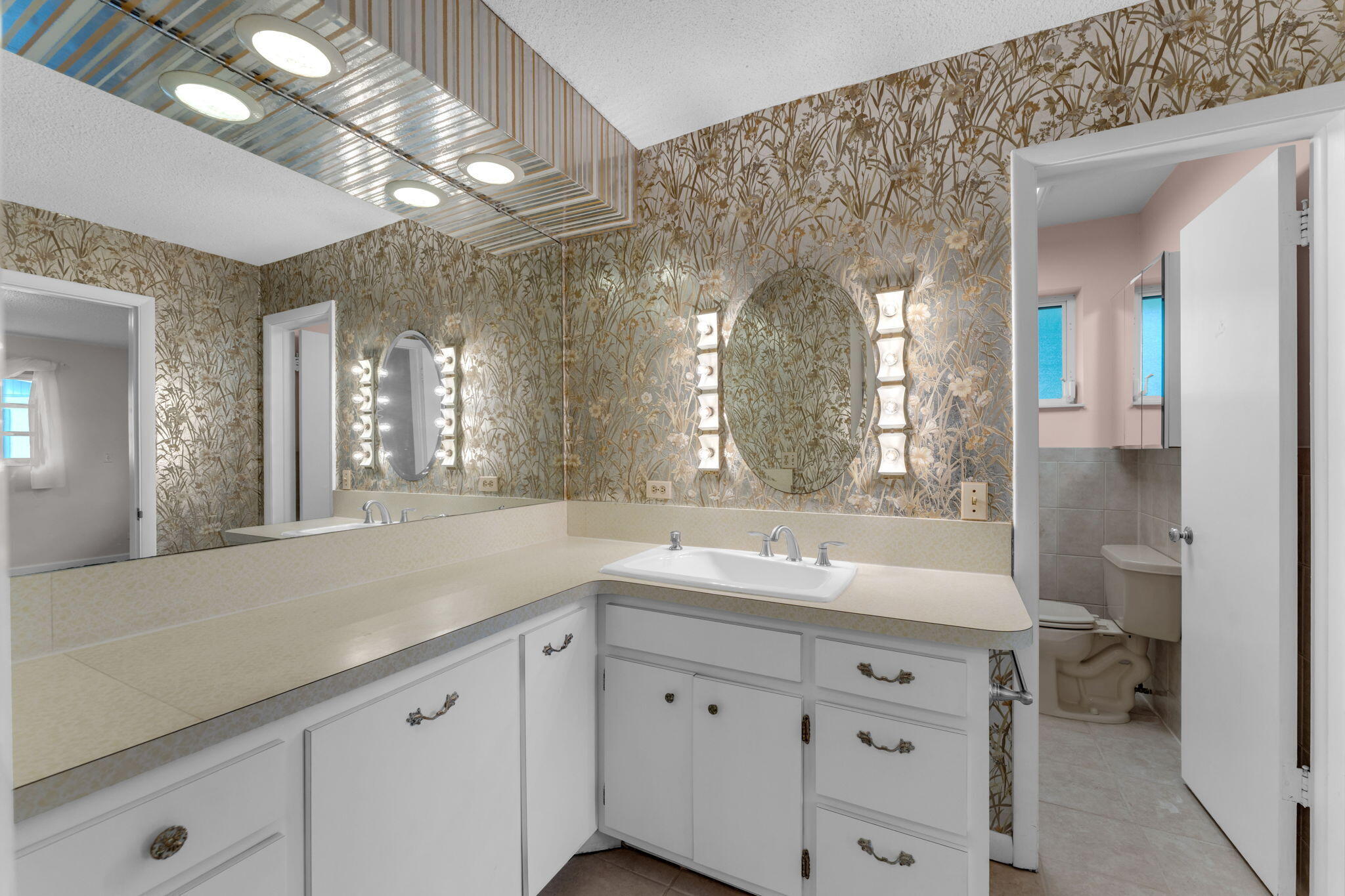 920 La Paloma Road Key Largo, FL 33037 - Photo 24 of 44 a spacious bathroom with a double vanity sink mirror and toilet