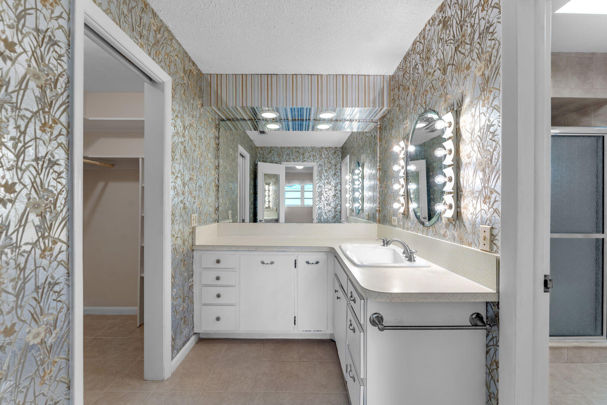 920 La Paloma Road Key Largo, FL 33037 - Photo 25 of 44 a bathroom with a sink and a mirror