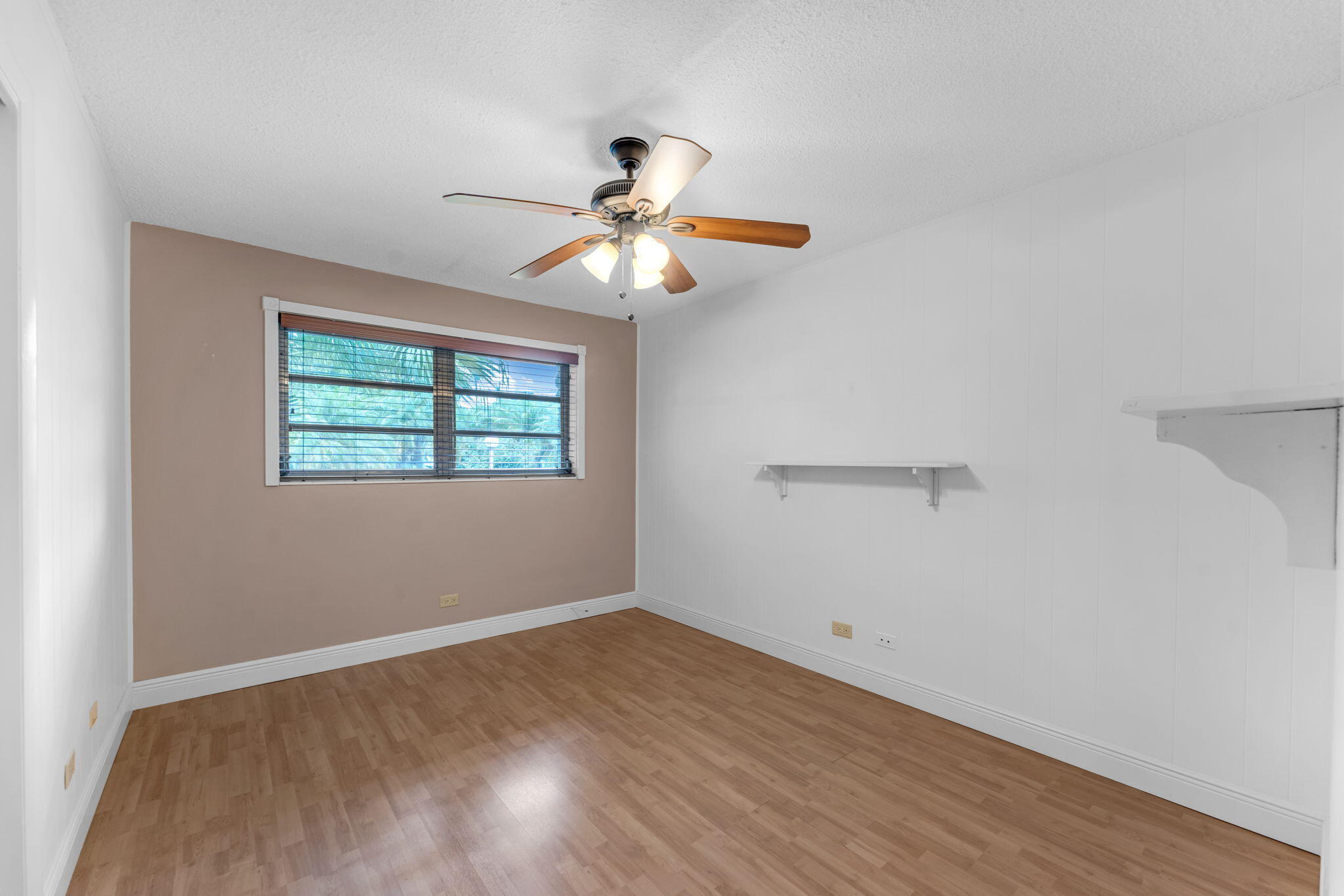 920 La Paloma Road Key Largo, FL 33037 - Photo 28 of 44 wooden floor in an empty room with a window