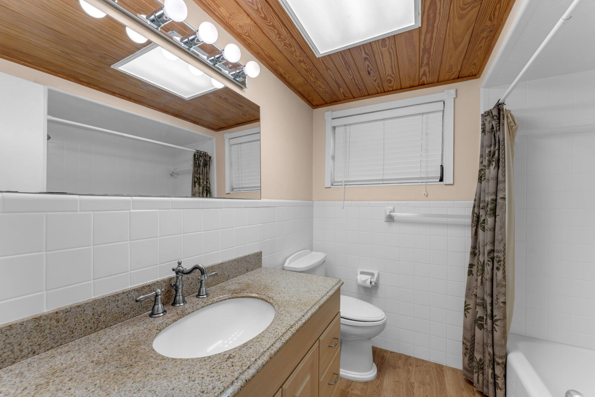 920 La Paloma Road Key Largo, FL 33037 - Photo 29 of 44 a bathroom with a granite countertop sink toilet a mirror and shower