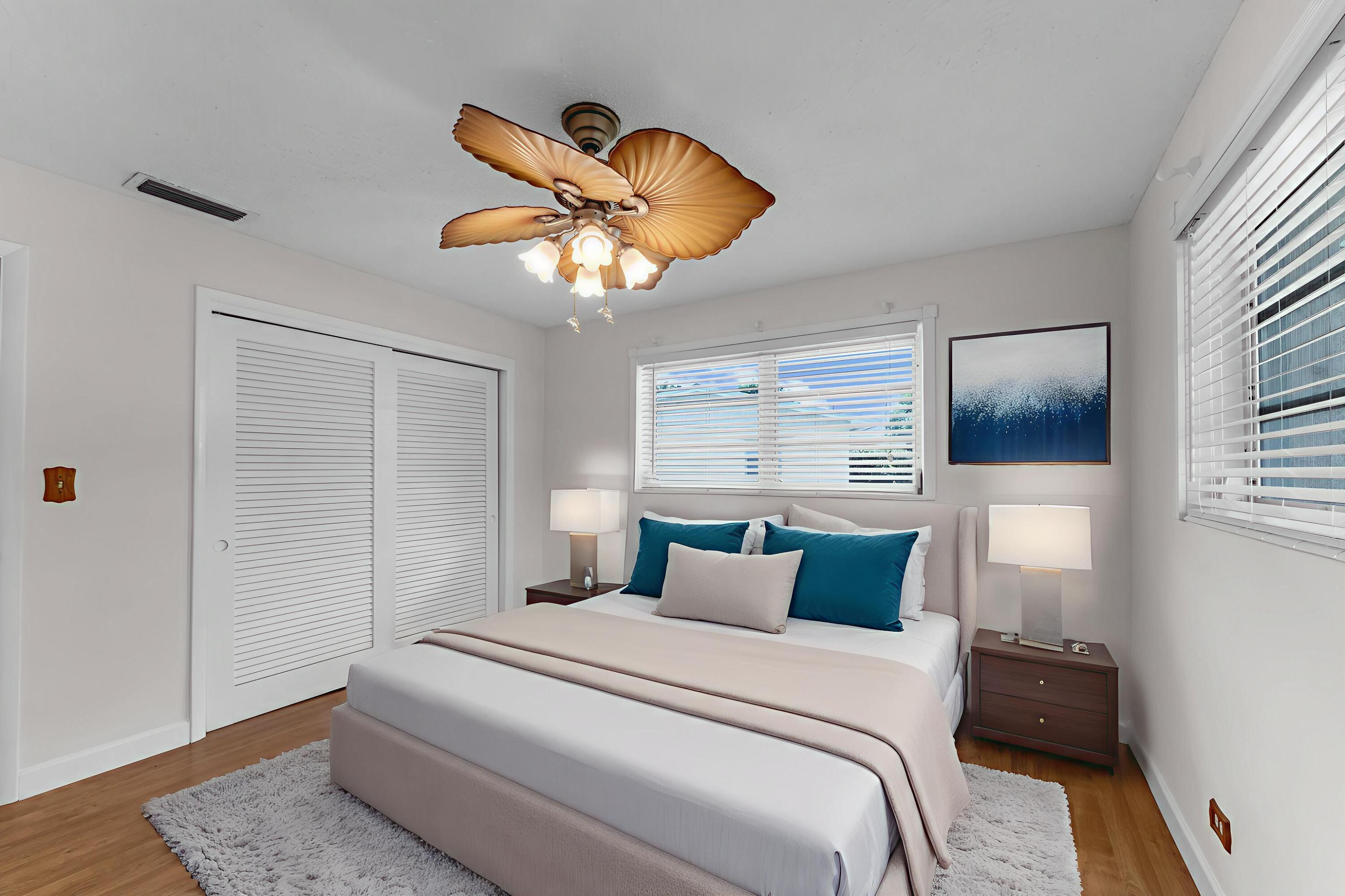 920 La Paloma Road Key Largo, FL 33037 - Photo 31 of 44 a bedroom with a bed and a chandelier