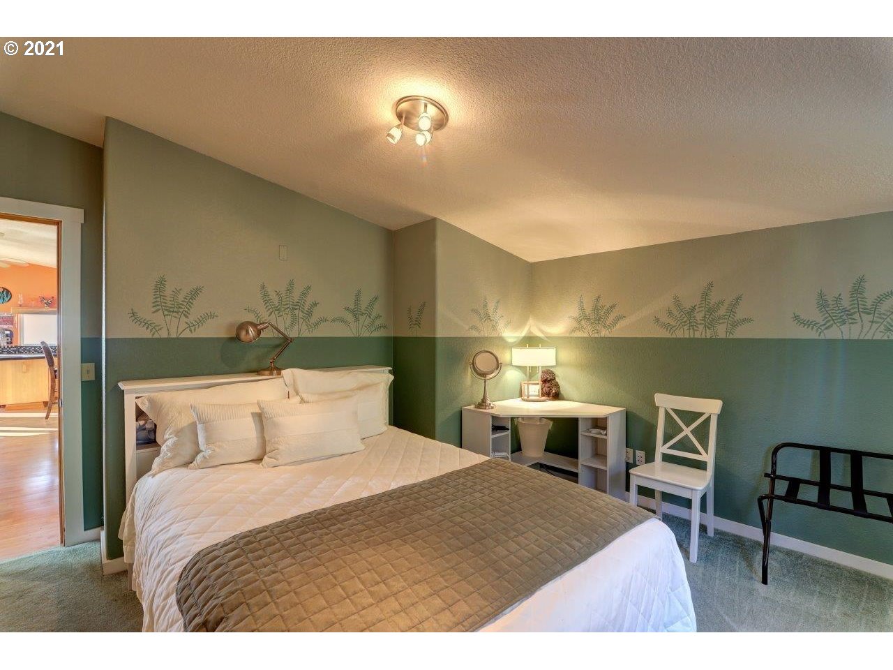 32307 Ruby Lane Cannon Beach, OR 97110 - Photo 13 of 27 a bedroom with a bed and a table