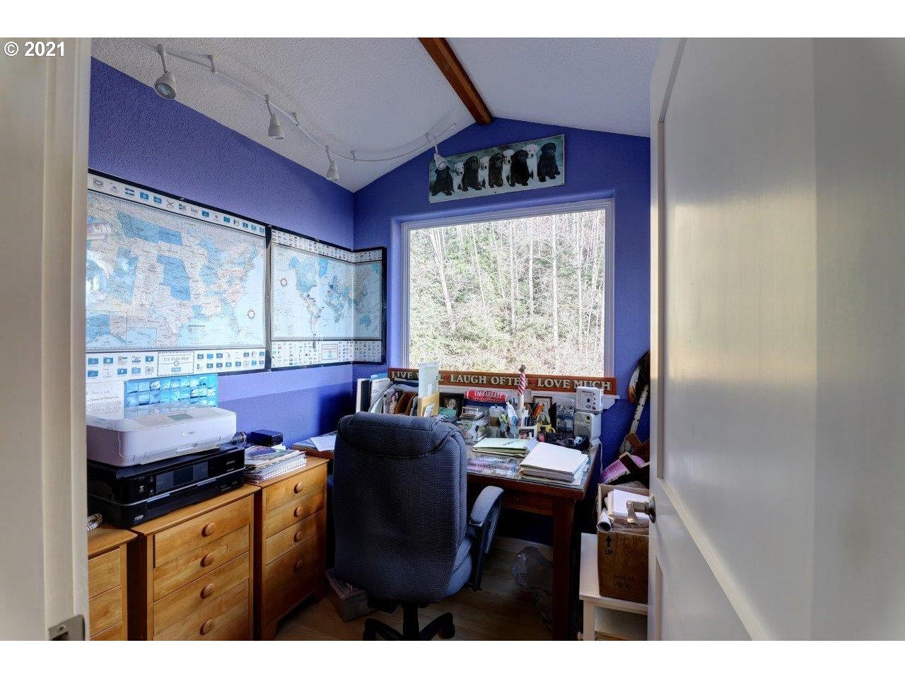 32307 Ruby Lane Cannon Beach, OR 97110 - Photo 15 of 27 a view of a dining room with furniture a chandelier and wooden floor