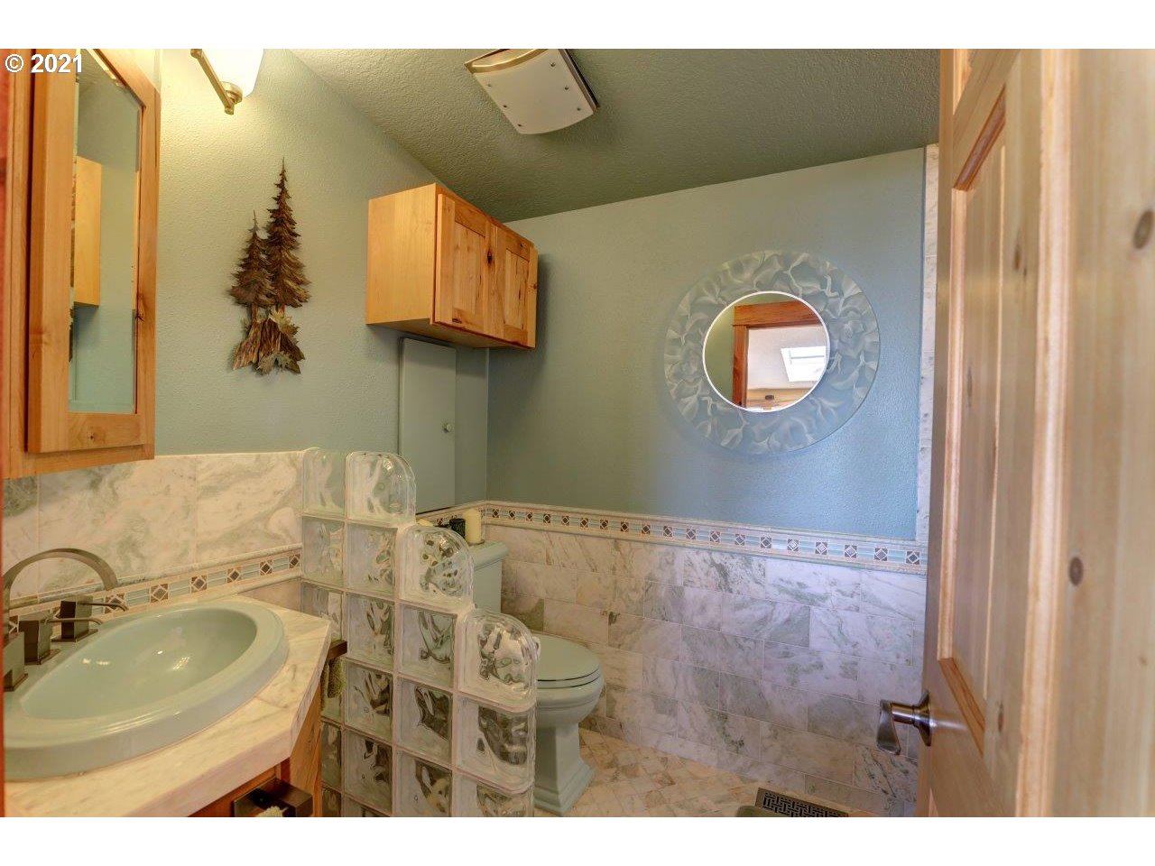 32307 Ruby Lane Cannon Beach, OR 97110 - Photo 16 of 27 a bathroom with a sink and a mirror
