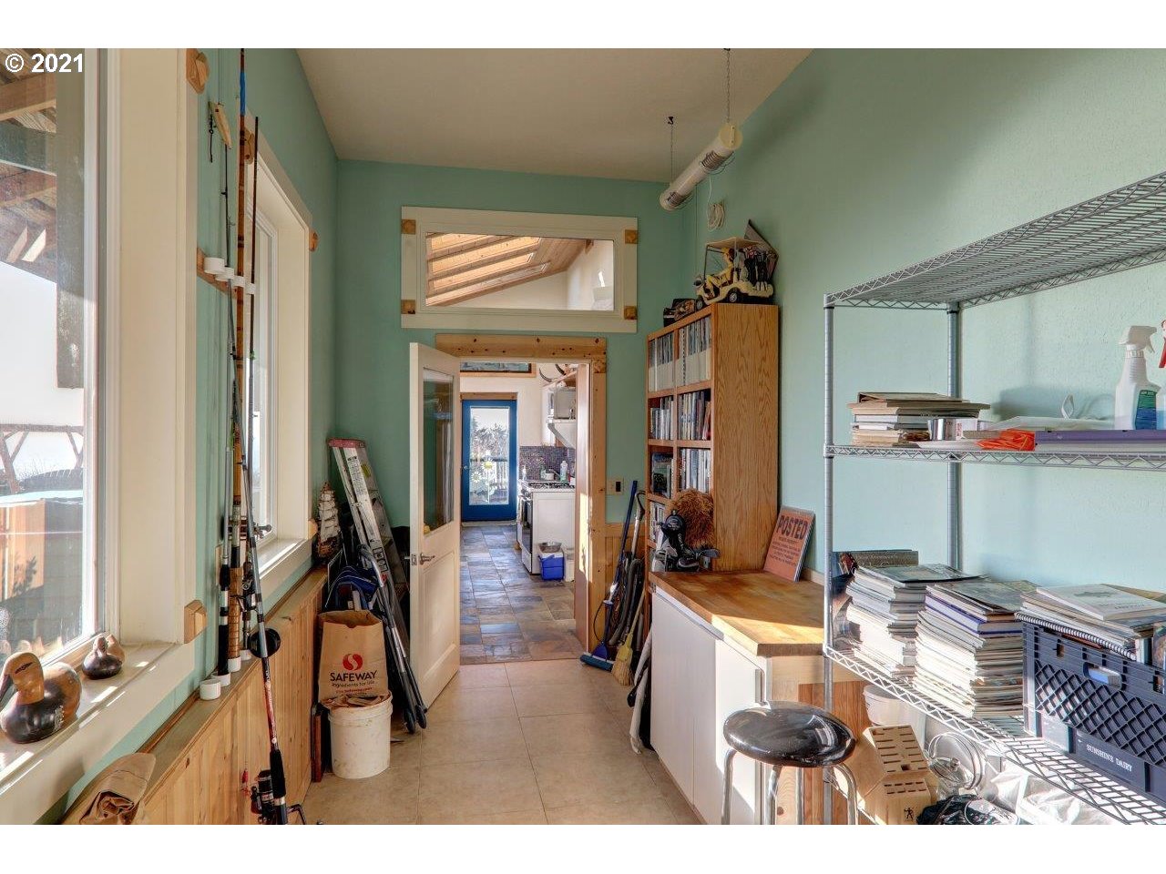32307 Ruby Lane Cannon Beach, OR 97110 - Photo 19 of 27 a living room with furniture a flat screen tv and a table