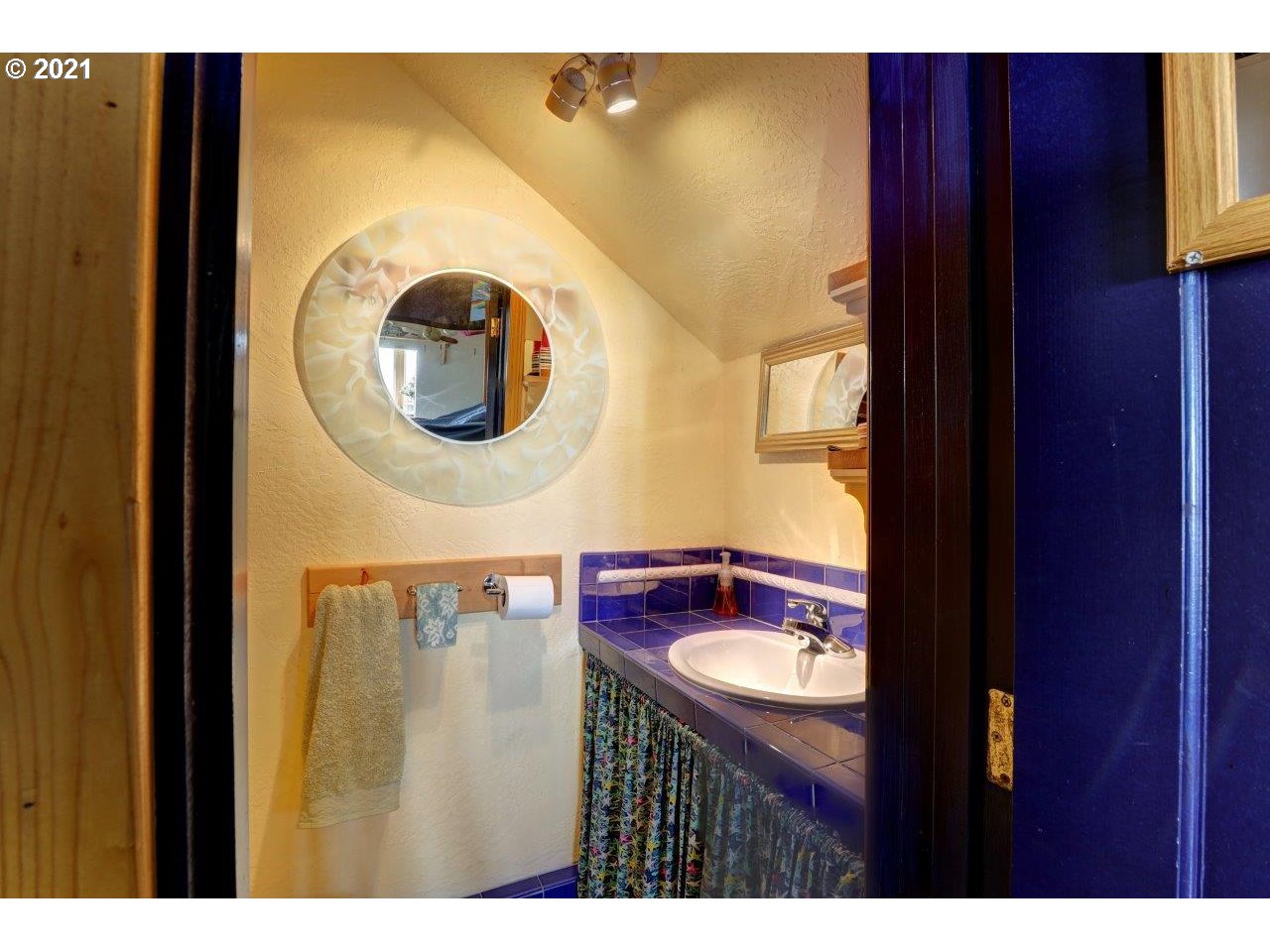32307 Ruby Lane Cannon Beach, OR 97110 - Photo 20 of 27 a bathroom with a sink and a mirror
