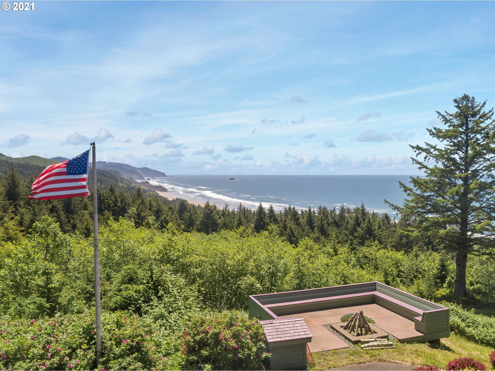 32307 Ruby Lane Cannon Beach, OR 97110 - Photo 4 of 27 a view of a yard with mountain and wooden floor