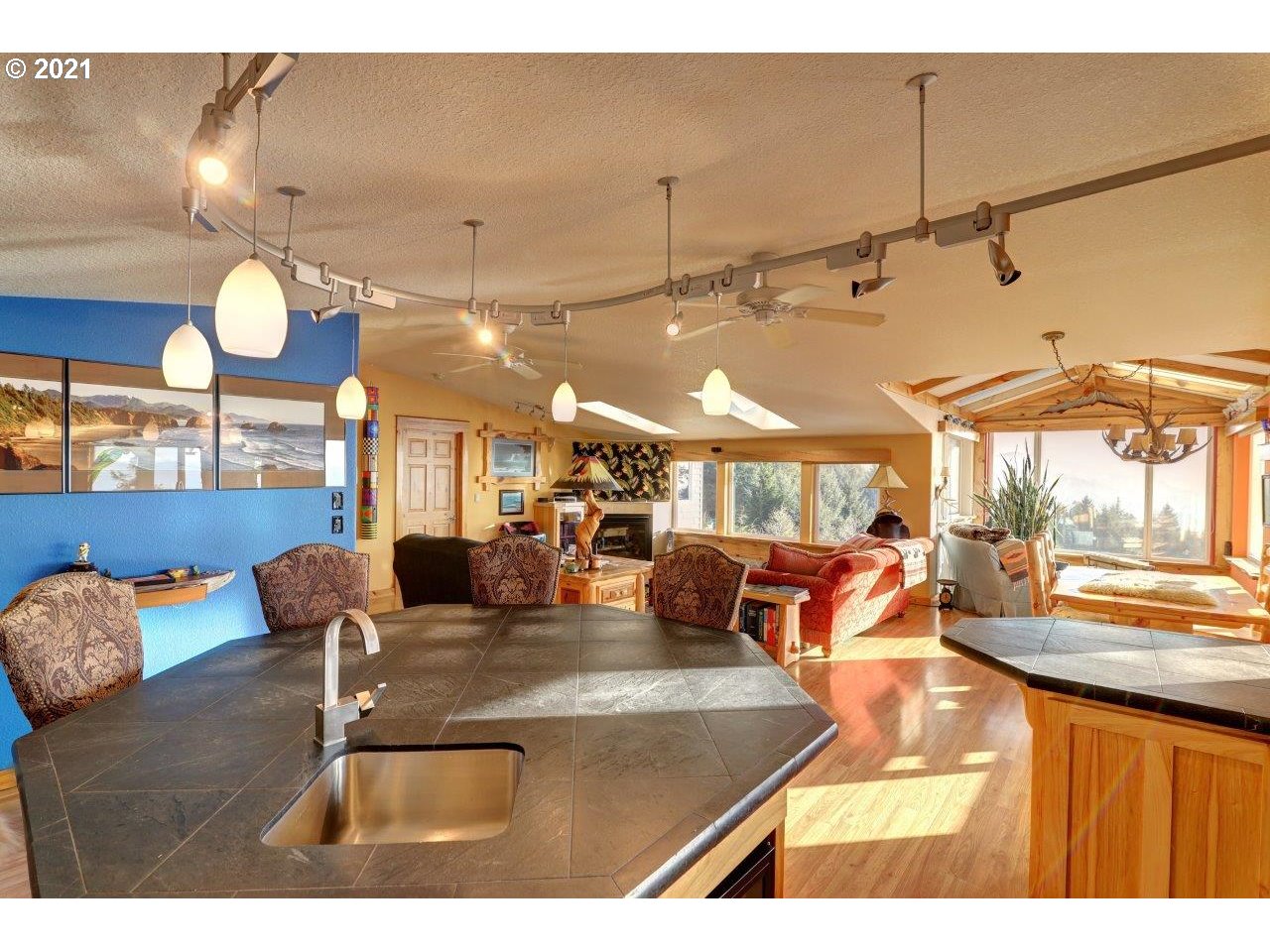 32307 Ruby Lane Cannon Beach, OR 97110 - Photo 9 of 27 a outdoor dining area with furniture and a large window