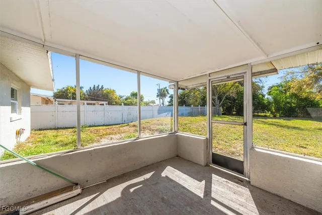 a kitchen with a white wooden cabinets and white appliances