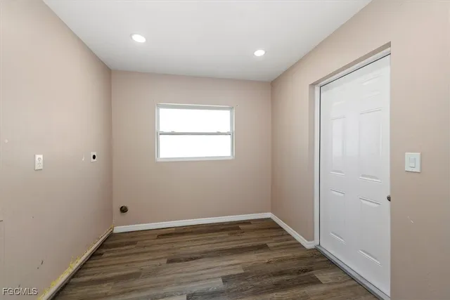 a view of hallway with wooden floor