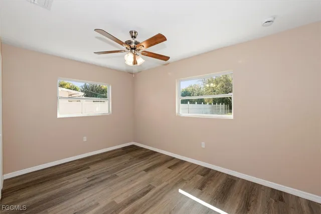 a bathroom with a toilet a sink and a mirror