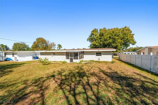 a view of a yard with swimming pool
