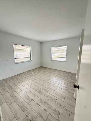 a view of a room that has a window in it