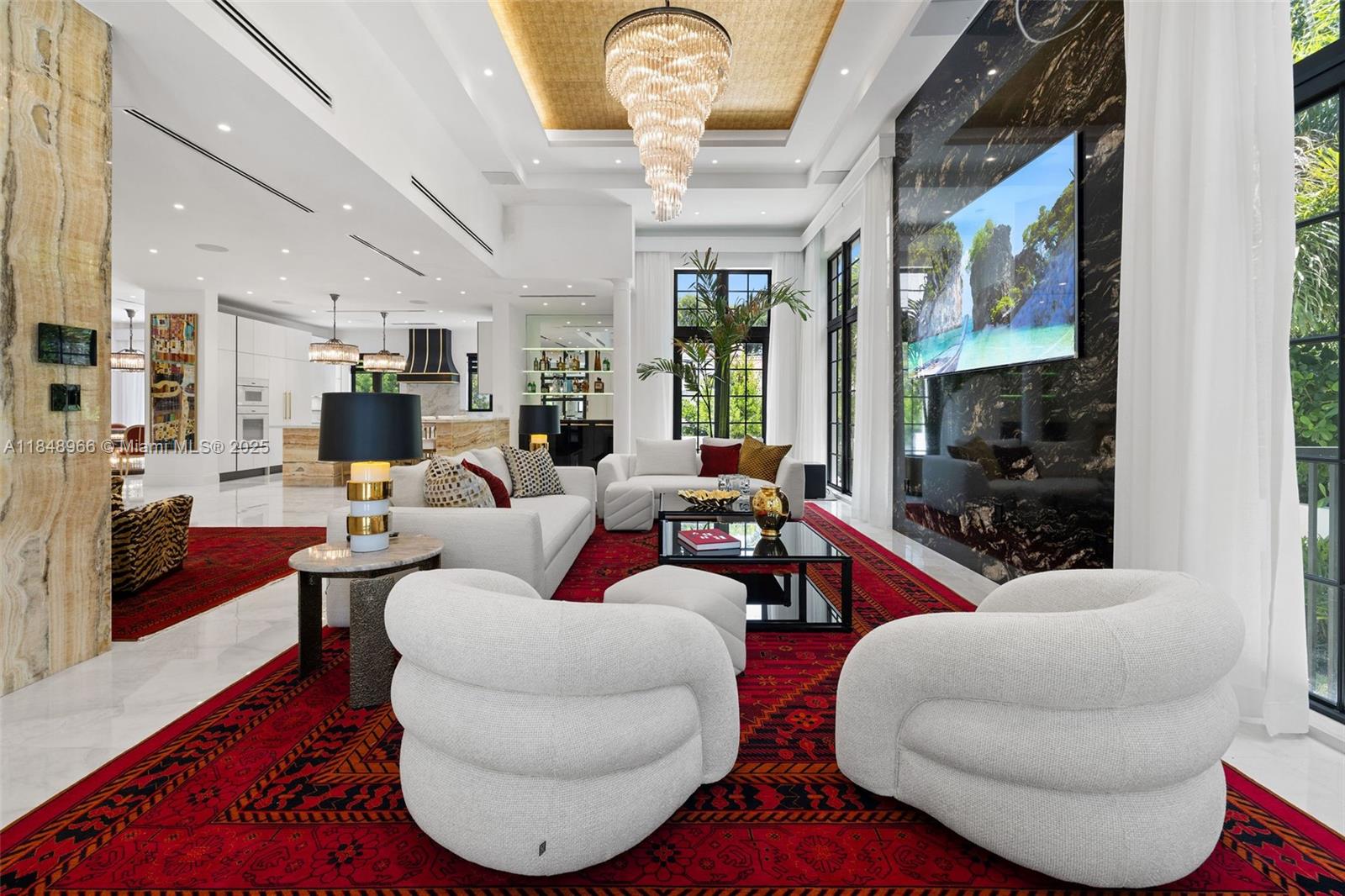 2321 North Bay Road Miami Beach, FL 33140 - Photo 12 of 77 a living room with furniture a rug and a chandelier