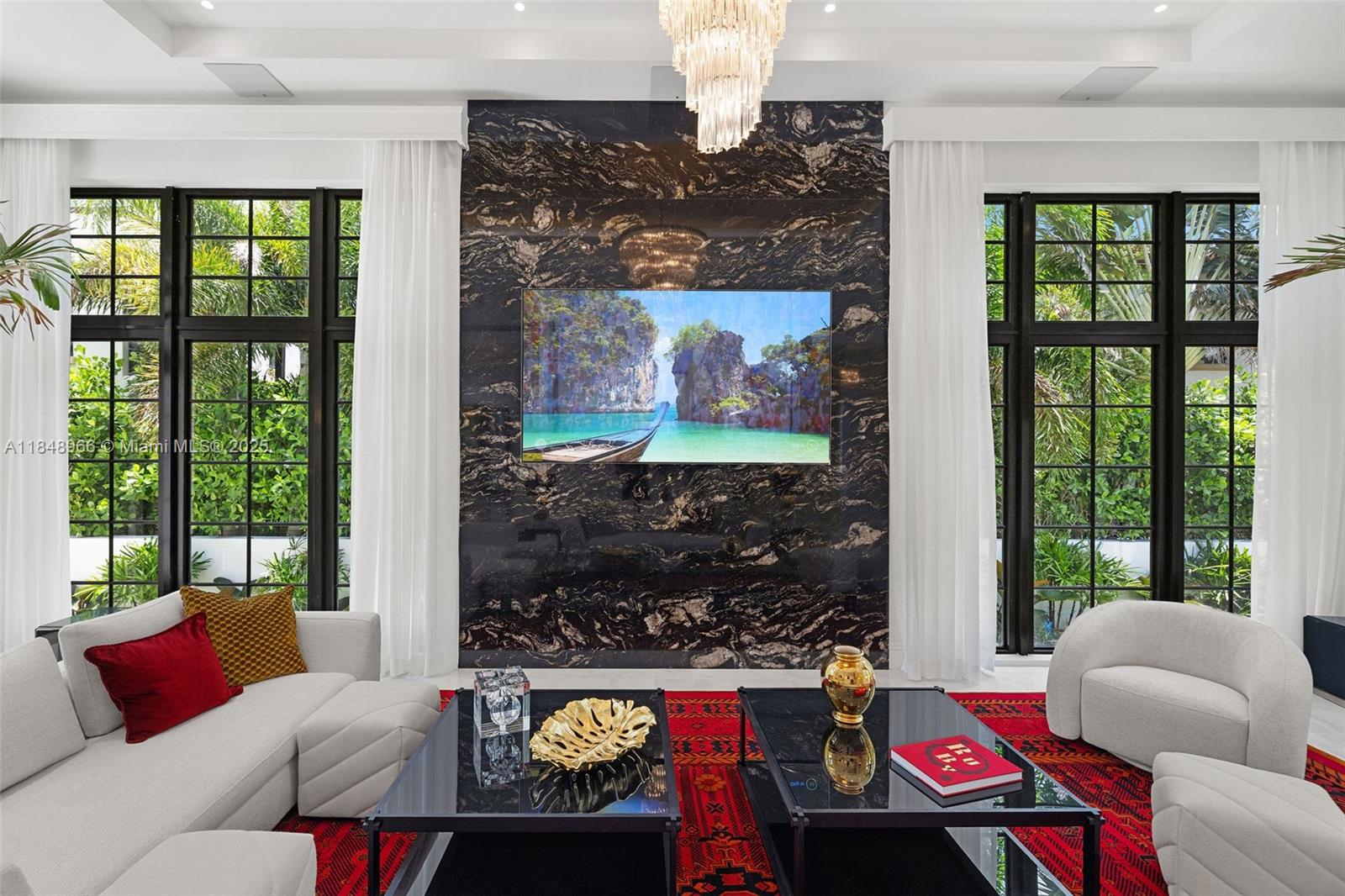 2321 North Bay Road Miami Beach, FL 33140 - Photo 14 of 77 a living room with furniture and a floor to ceiling window