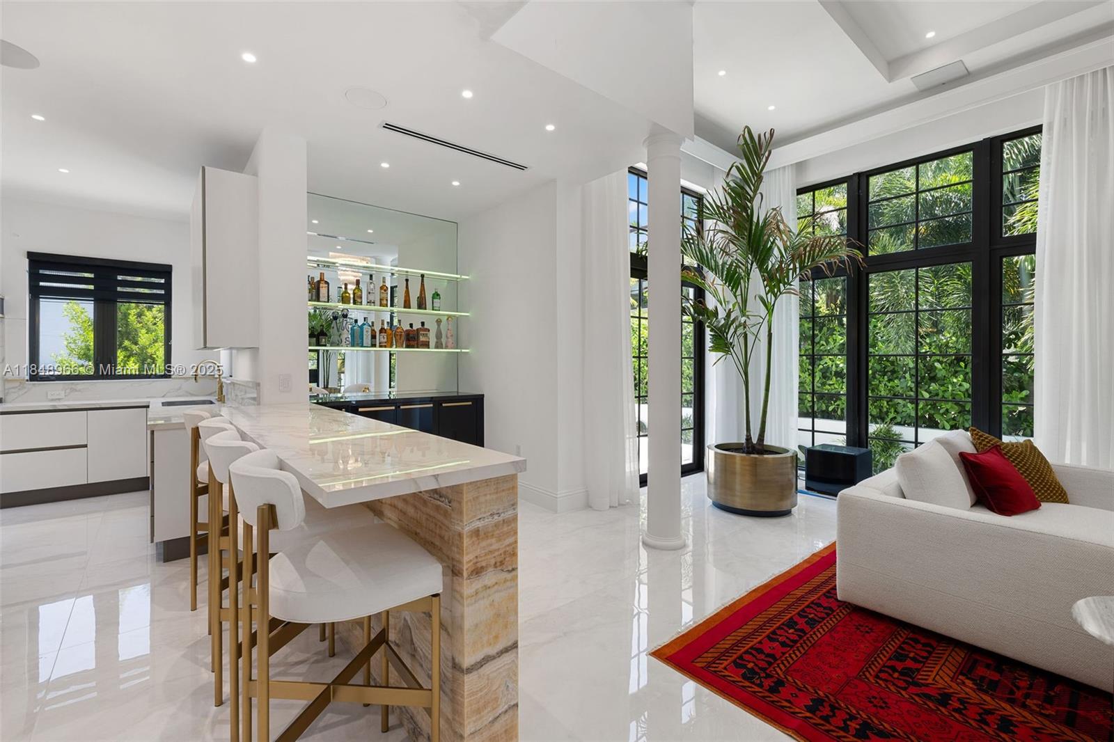 2321 North Bay Road Miami Beach, FL 33140 - Photo 22 of 77 a living room with furniture and a large window