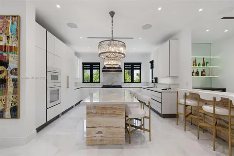 a view of a livingroom with furniture and stairs