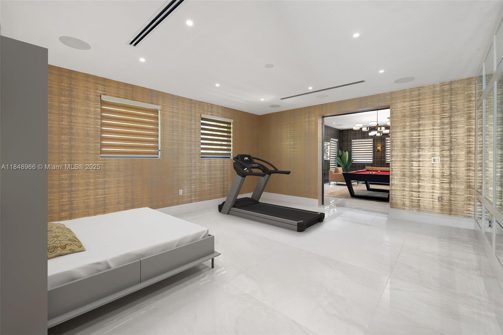 2321 North Bay Road Miami Beach, FL 33140 - Photo 34 of 77 a bedroom with furniture and a large window