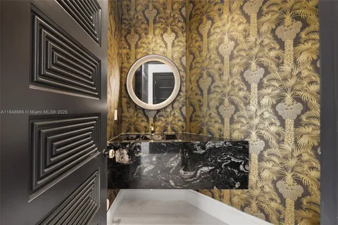 a kitchen with a sink and a granite top