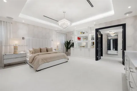 an aerial view of a house with outdoor space and pool view