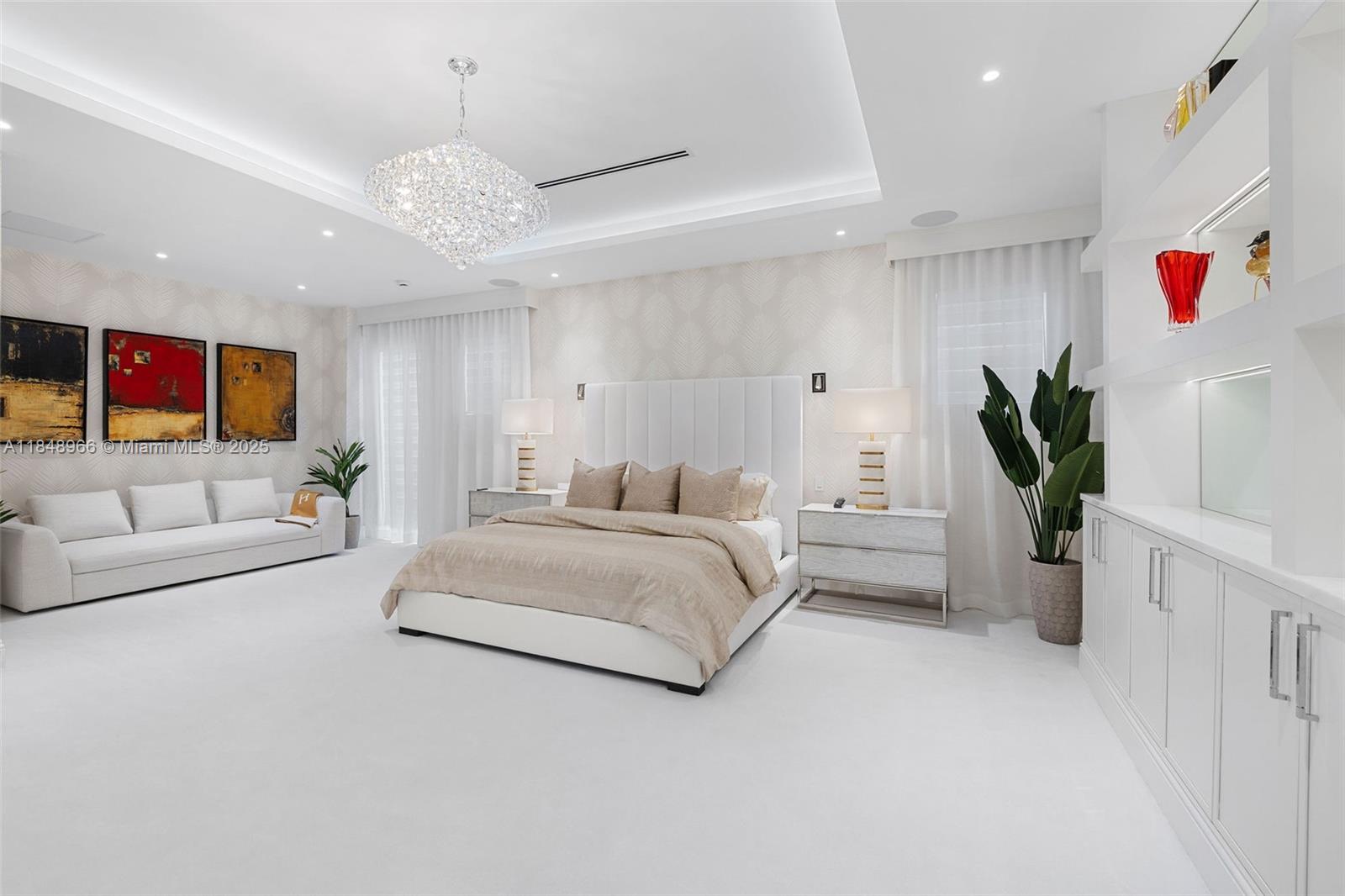 2321 North Bay Road Miami Beach, FL 33140 - Photo 44 of 77 a living room with furniture and a chandelier