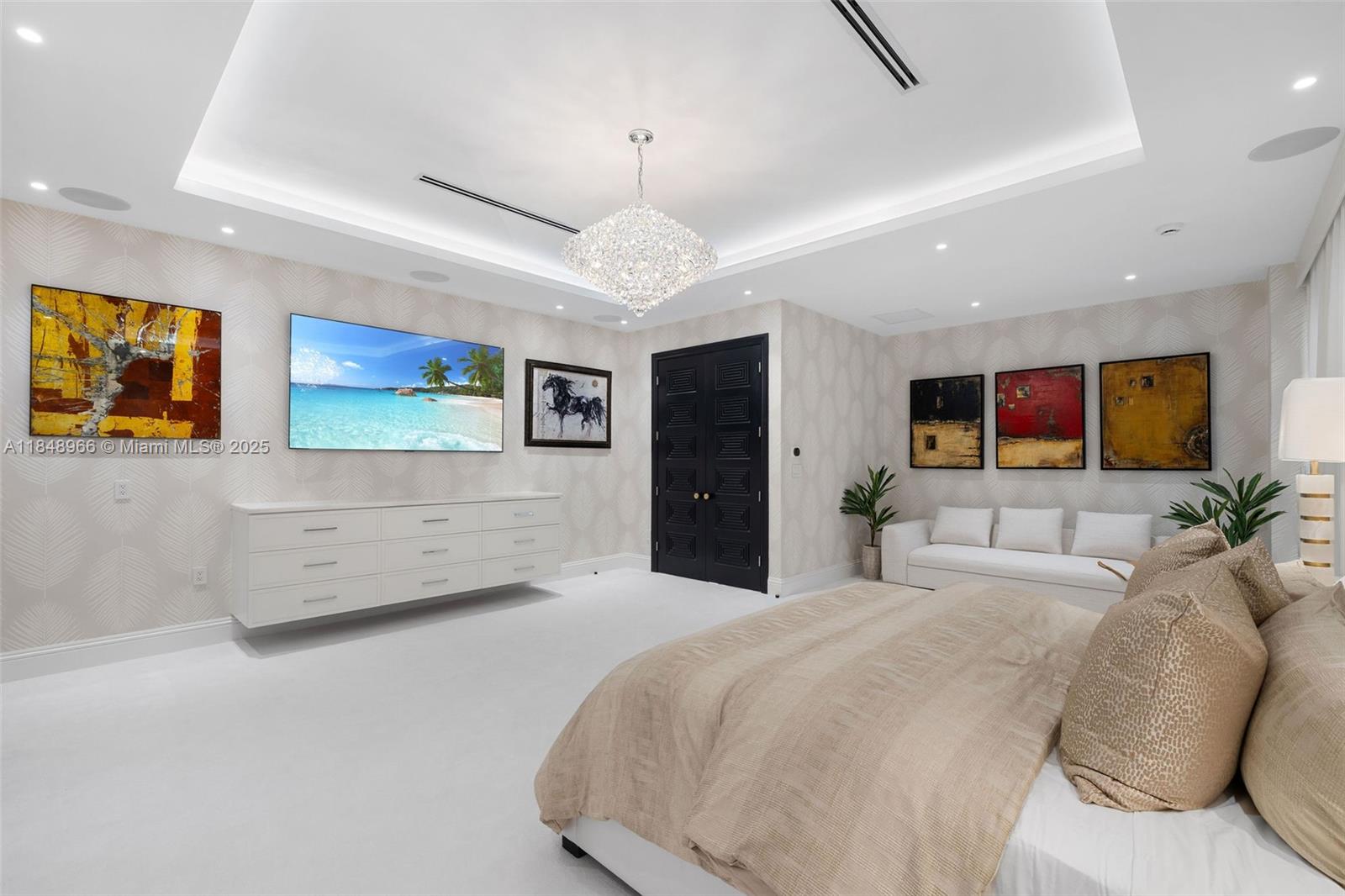 2321 North Bay Road Miami Beach, FL 33140 - Photo 46 of 77 a spacious bedroom with a bed and a flat screen tv