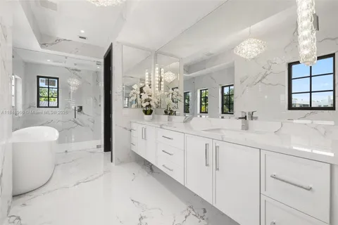 an aerial view of a house with a lake view