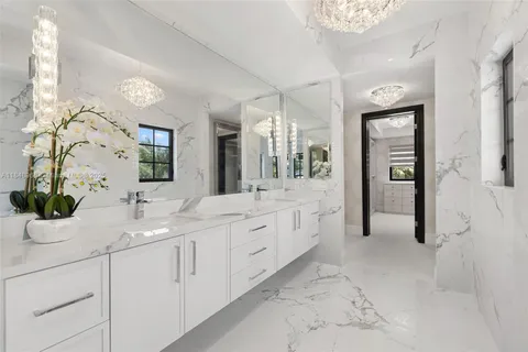 an aerial view of a house with outdoor space and lake view