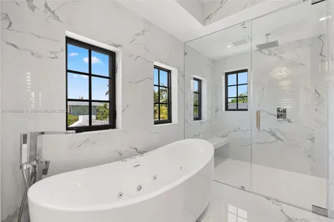 an aerial view of city and lake