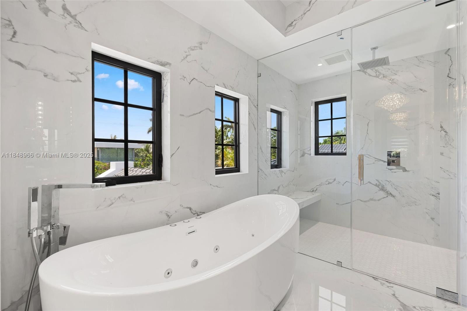 2321 North Bay Road Miami Beach, FL 33140 - Photo 50 of 77 a white bath tub sitting next to a white sink