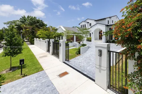 a living room with furniture a rug and a chandelier