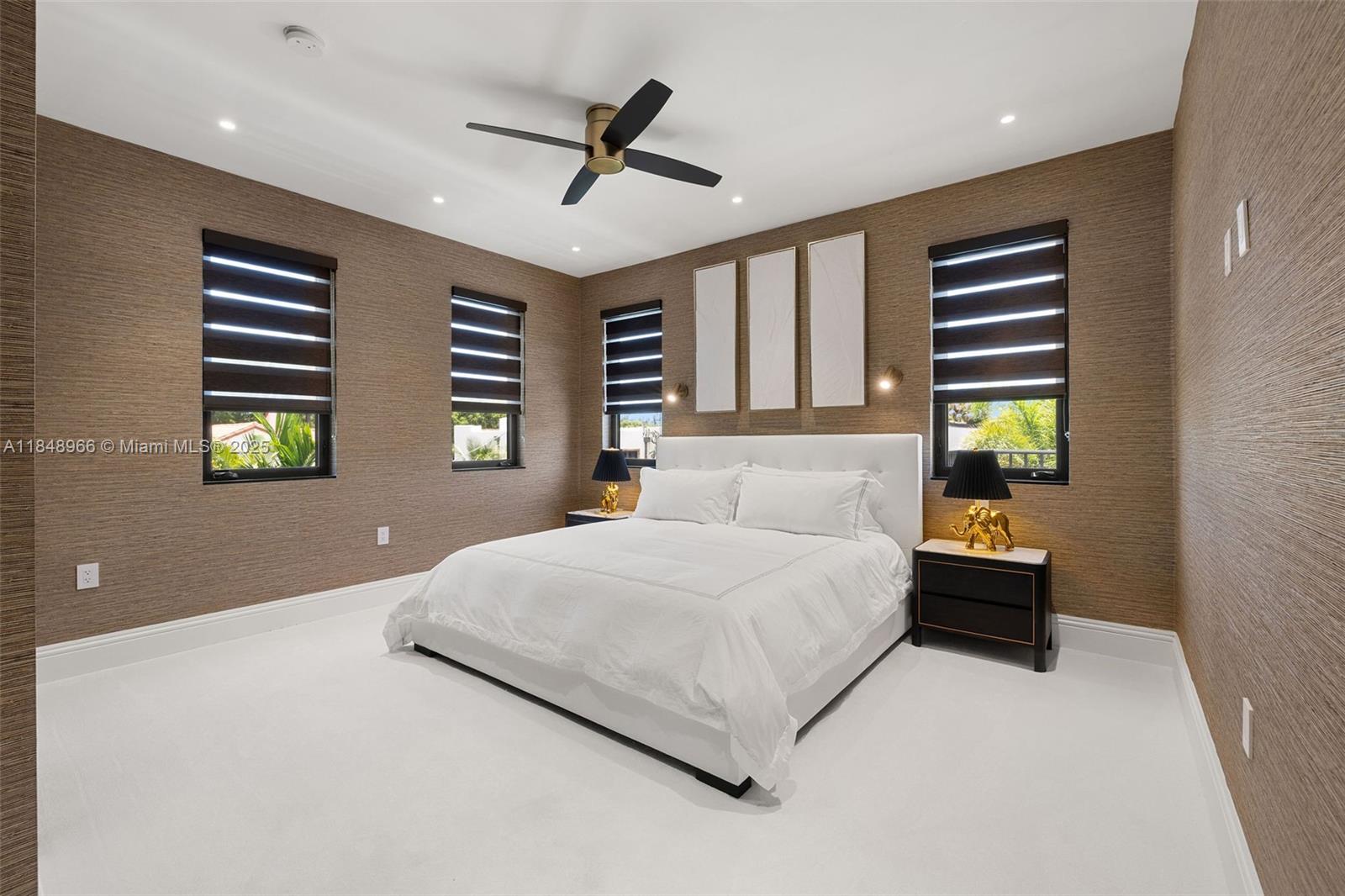 2321 North Bay Road Miami Beach, FL 33140 - Photo 53 of 77 a bedroom with a bed and a window