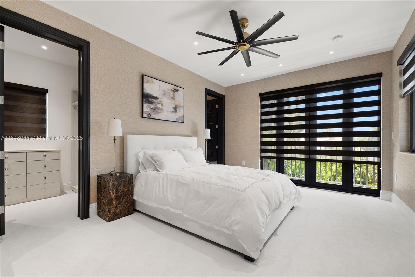 2321 North Bay Road Miami Beach, FL 33140 - Photo 55 of 77 a bedroom with a large bed and a tv