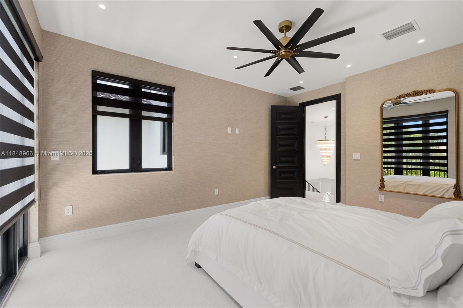 2321 North Bay Road Miami Beach, FL 33140 - Photo 56 of 77 a bedroom with a bed and a large window