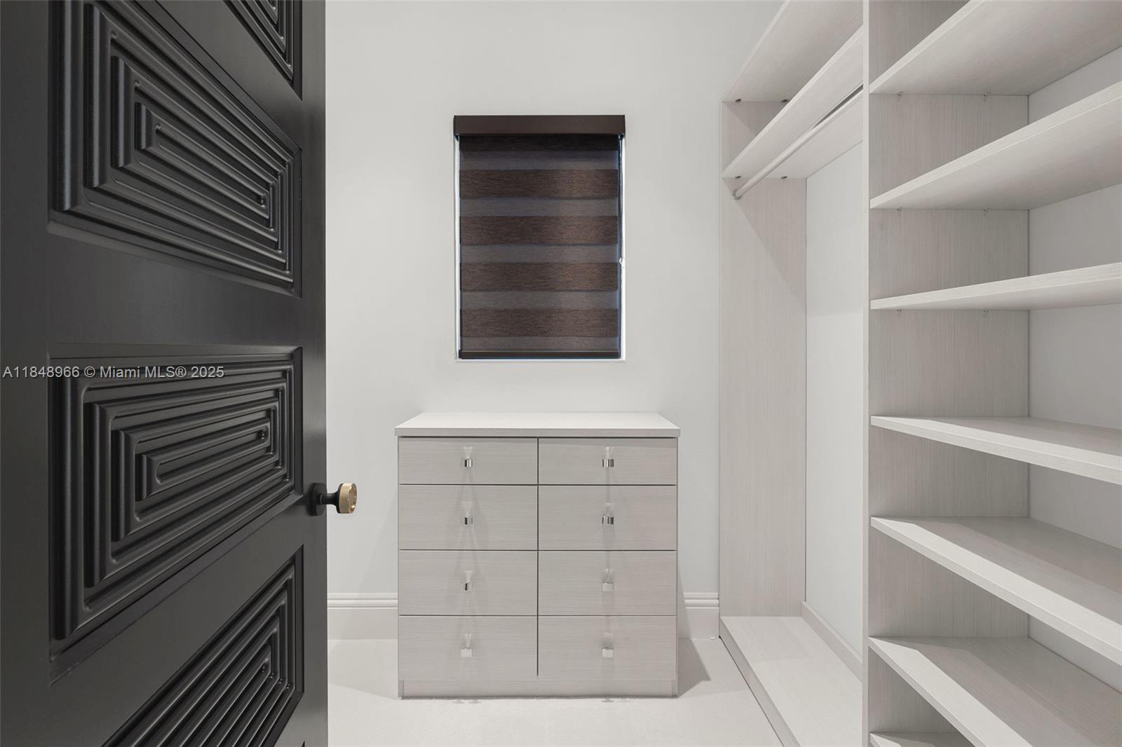 2321 North Bay Road Miami Beach, FL 33140 - Photo 58 of 77 a view of an empty walk in closet