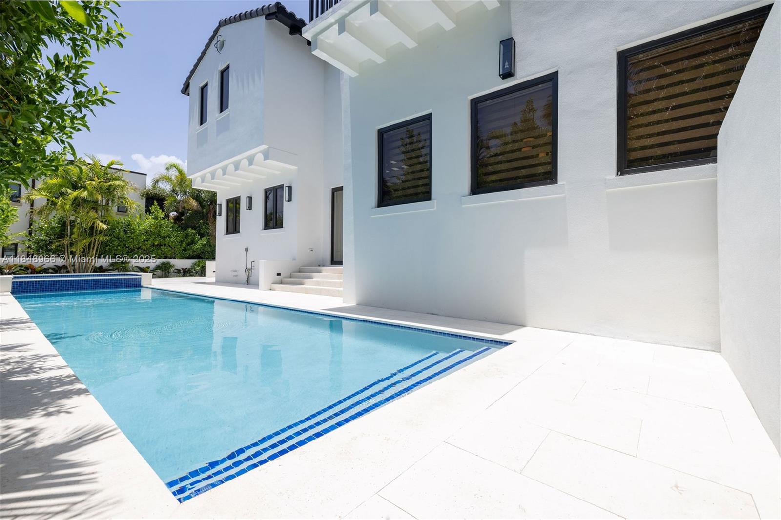 2321 North Bay Road Miami Beach, FL 33140 - Photo 64 of 77 a view of balcony with two large window and potted plants