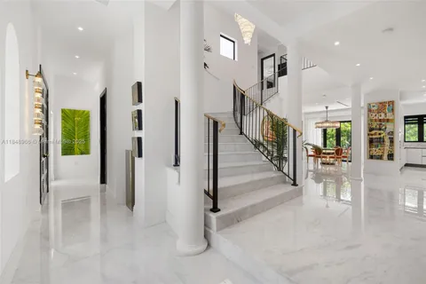 a living room with furniture or couch and a large window