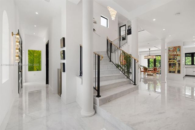 a living room with furniture or couch and a large window