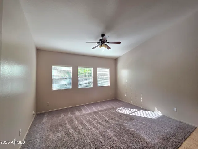 a kitchen with kitchen island granite countertop a stove and a sink