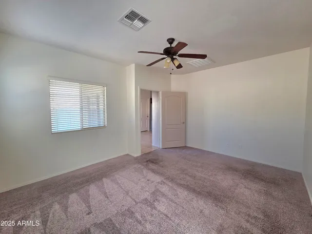 a bathroom with a double vanity sink a large mirror and a bathtub