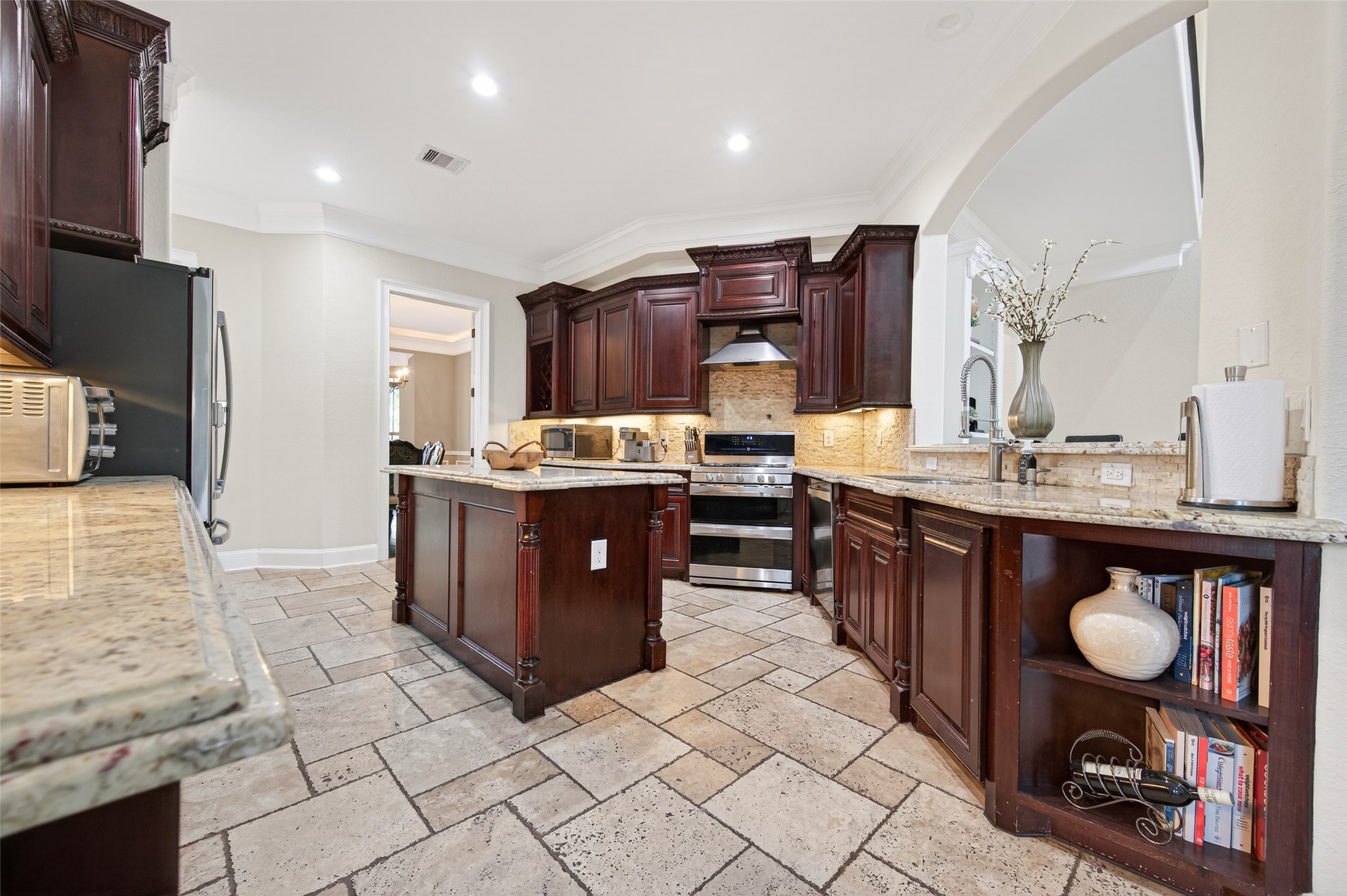 633 Crenshaw Road Houston, TX 77504 - Photo 19 of 50 a kitchen with stainless steel appliances granite countertop a sink counter space and cabinets
