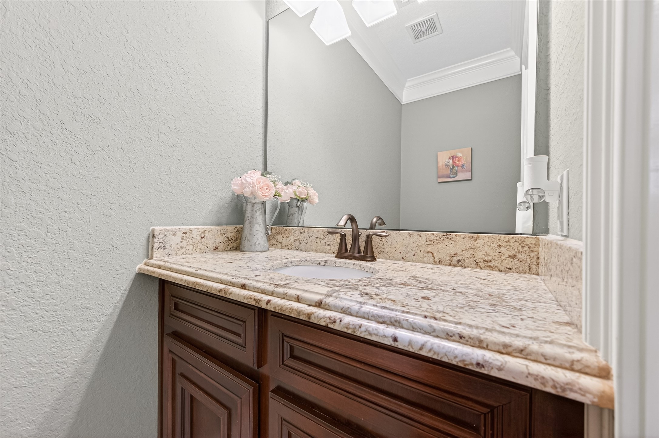 633 Crenshaw Road Houston, TX 77504 - Photo 26 of 50 a bathroom with a granite countertop sink and a mirror