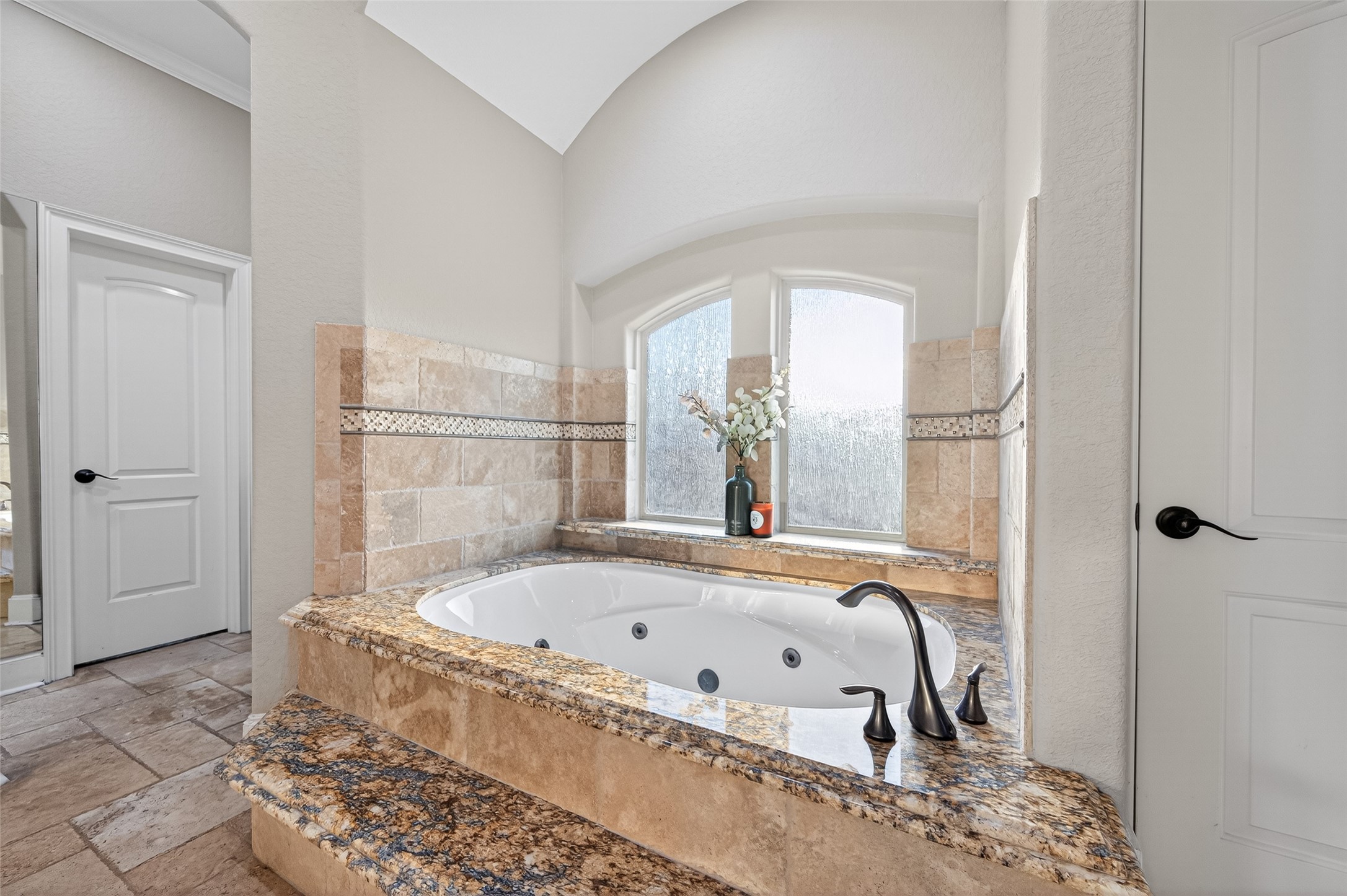 633 Crenshaw Road Houston, TX 77504 - Photo 32 of 50 a bathroom with a tub and a shower