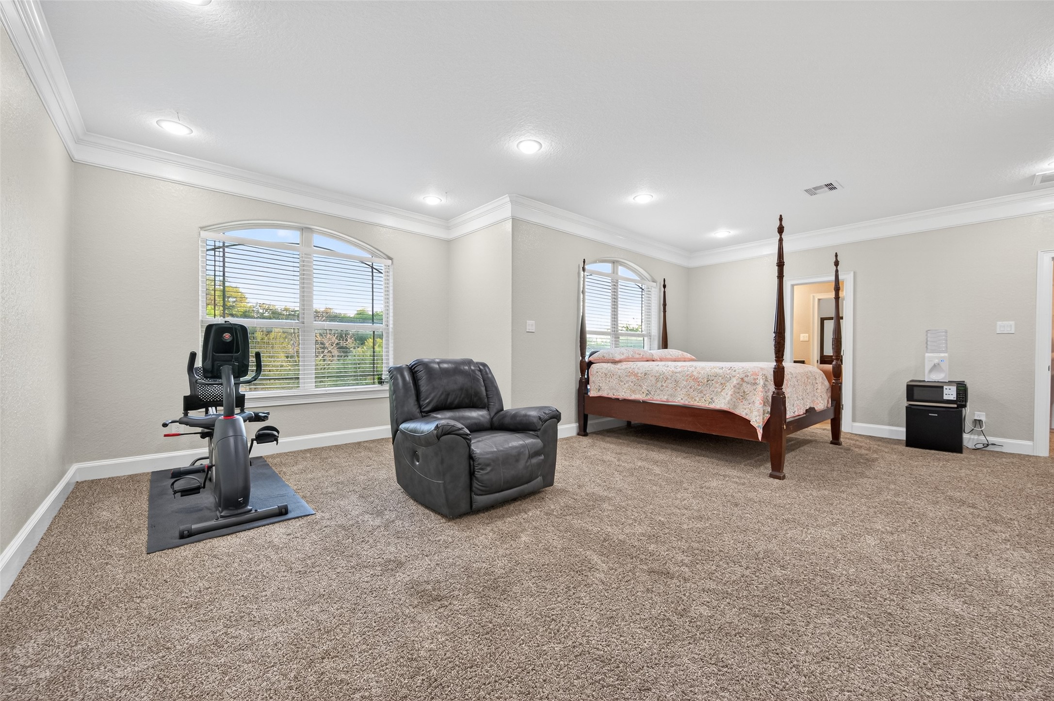 633 Crenshaw Road Houston, TX 77504 - Photo 36 of 50 a living room with furniture a window and gym equipment