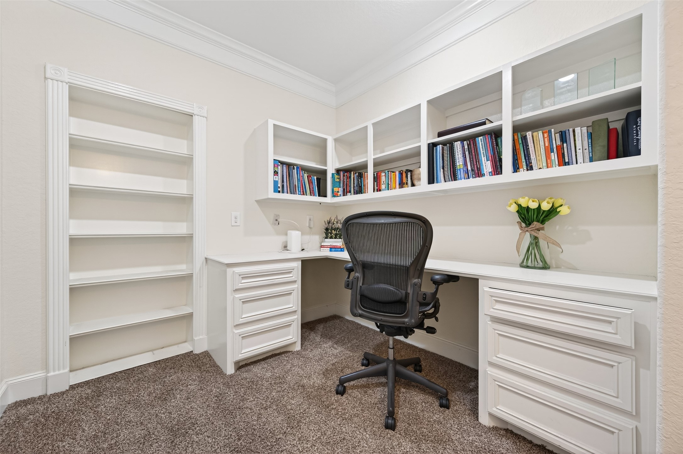 633 Crenshaw Road Houston, TX 77504 - Photo 41 of 50 a view of a workspace with furniture and a book shelf