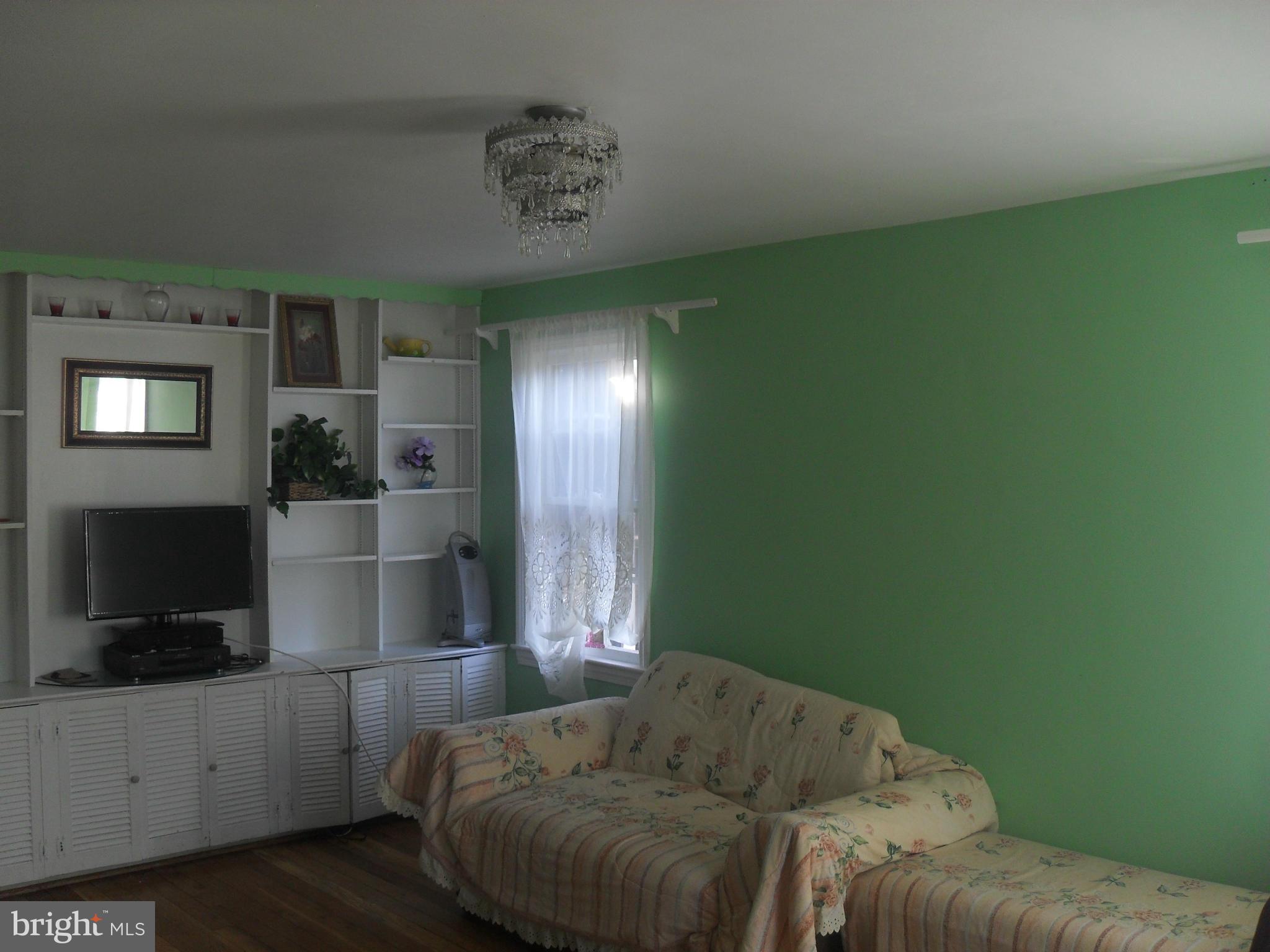 2014 Evans Parkway Silver Spring, MD 20902 - Photo 8 of 8 a living room with furniture and a flat screen tv