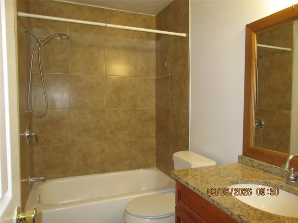 a view of a bathroom from a hallway