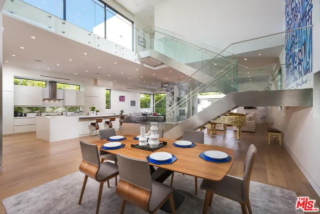 a view of a dining room with furniture wooden floor and a rug